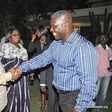 Adakabri F. Manso in a handshake with Nana Akufo-Addo and looking on is Elizabeth Ohene.