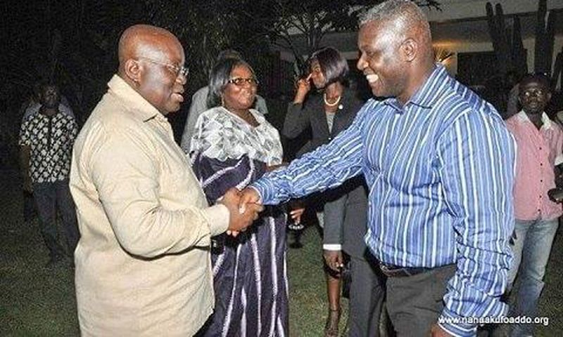 Adakabri F. Manso in a handshake with Nana Akufo-Addo and looking on is Elizabeth Ohene.