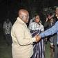 Adakabri F. Manso in a handshake with Nana Akufo-Addo and looking on is Elizabeth Ohene.