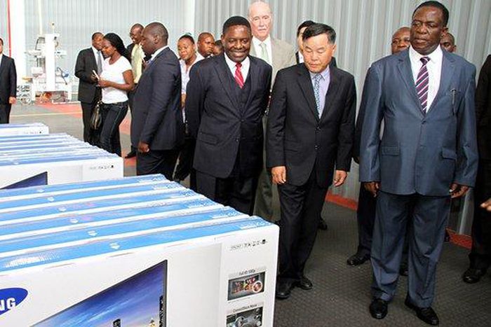 Acting President Emmerson Mnangagwa tours the SamZim plant, which assembles Samsung electronic gadgets, accompanied by the firm’s chairman Mr YC Baik and Director-General in the President’s Office Retired Major-General Happyton Bonyongwe in Harare