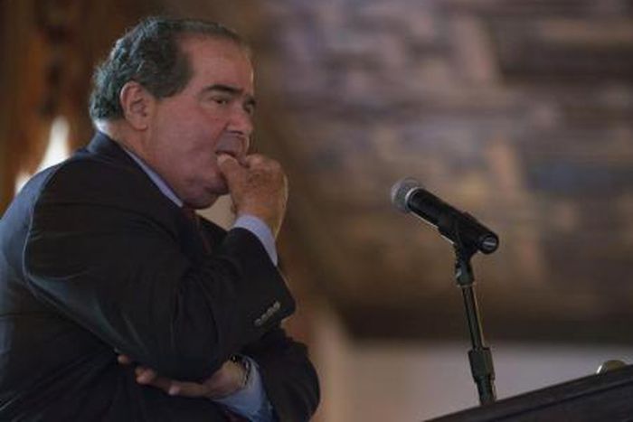 U.S. Supreme Court Justice Antonin Scalia listens to a question after speaking at an event sponsored by the Federalist Society at the New York Athletic Club in New York October 13, 2014.
