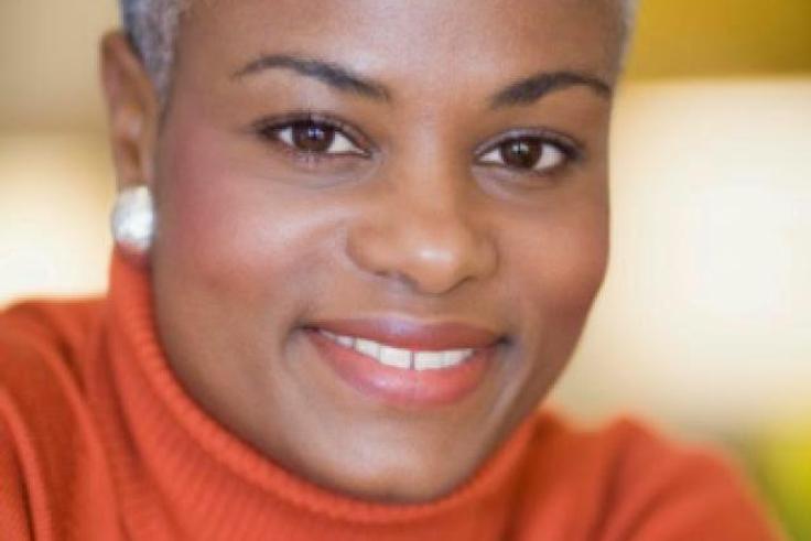 Black woman with short gray hair