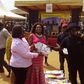 Guru donating 1000 books at a social gathering organized by The Ministry of Gender, Children and Social Protection at Moree in the central region of Ghana.