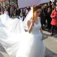 Woman models longest wedding dress ever