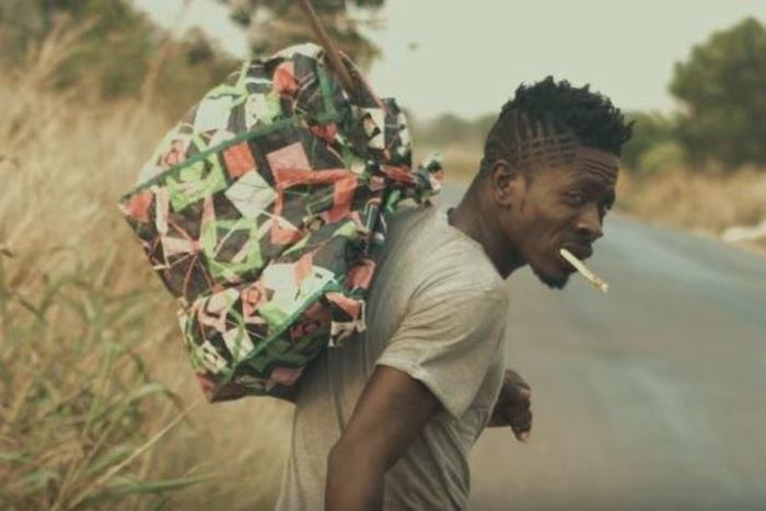 Shatta Wale walks on the street and shares his story in "Story To Tell" music video