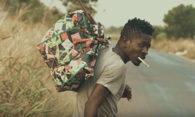 Shatta Wale walks on the street and shares his story in "Story To Tell" music video