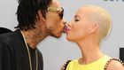 Wiz Khalifa and Amber Rose share a kiss