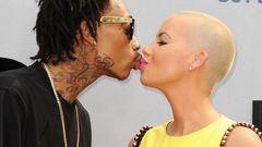 Wiz Khalifa and Amber Rose share a kiss