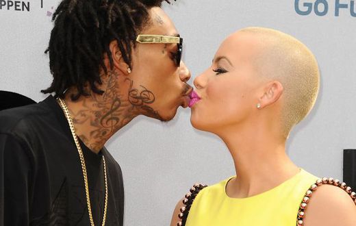 Wiz Khalifa and Amber Rose share a kiss