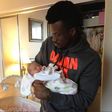 Peter Okoye holding his daughter Aliona three years ago