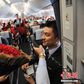 Flight attendant proposes to girlfriend mid-air on Valentine's Day