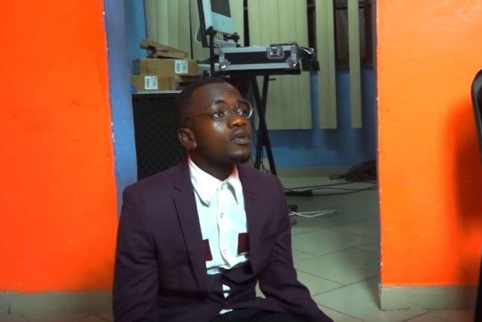 Ajeezay sits on the floor instead of the chair