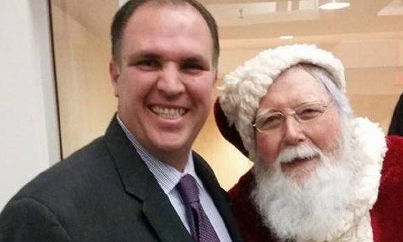 'Devout' Catholic Bill Metzger posing for a selfie with Santa