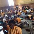 Pupils studying on the floor