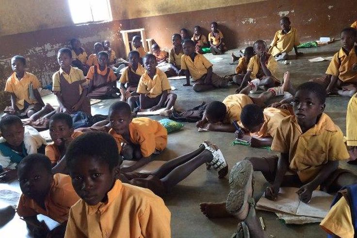 Pupils studying on the floor