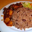 Waakye with chicken stew, fried plantain and steamed cabbage