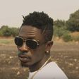 Shatta Wale stares at Prince Dovlo's camera in "Too Much Chemical" music video