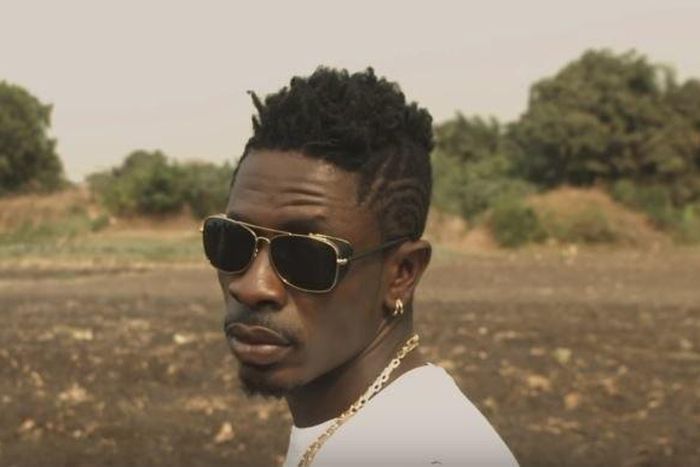 Shatta Wale stares at Prince Dovlo's camera in "Too Much Chemical" music video