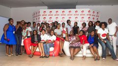 Some ladies of Airtel Ghana in a group photograph with Ms. Efua Addotey after the event.