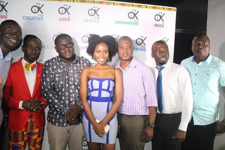 Okyeame and MzVee take group photos with management at "Small Small" video premiere at Grand Papaz