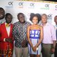 Okyeame and MzVee take group photos with management at "Small Small" video premiere at Grand Papaz