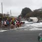 Residents scooping fuel as tanker overturns