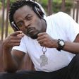 Kwaw Kese with a headset