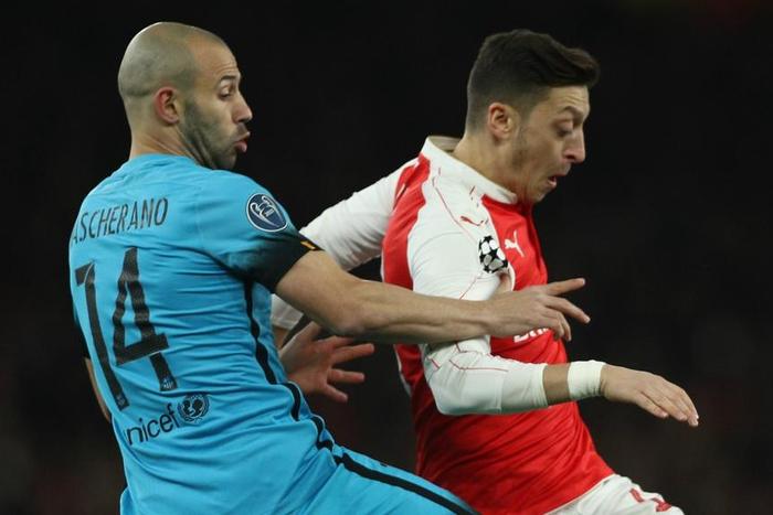 ___4726558___https:______static.pulse.com.gh___webservice___escenic___binary___4726558___2016___2___25___4___mascherano-ozil-cropped_la2bji2yyryo1l3uh465qez0e_2