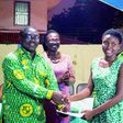 The Greater Accra Regional President of the Prempeh College Old Boys Association, Mr Kwabena Nyarko (left), presenting a cheque to Naa Adoley Saka (right ), a student of Achimota School in Accra
