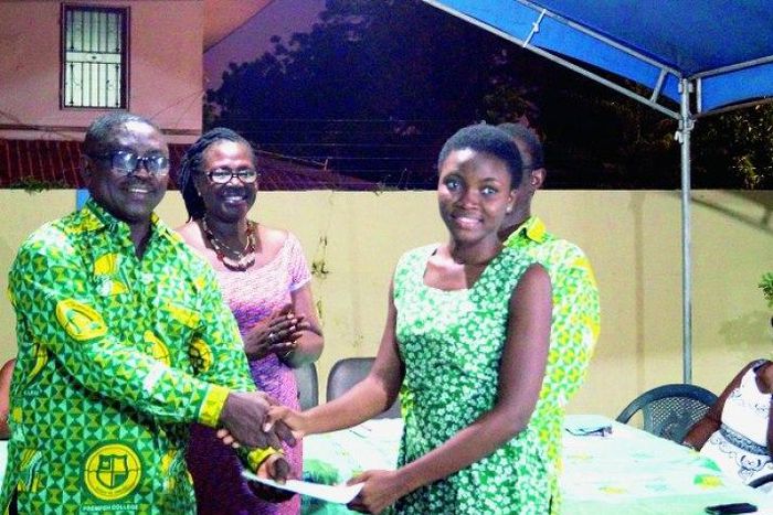 The Greater Accra Regional President of the Prempeh College Old Boys Association, Mr Kwabena Nyarko (left), presenting a cheque to Naa Adoley Saka (right ), a student of Achimota School in Accra