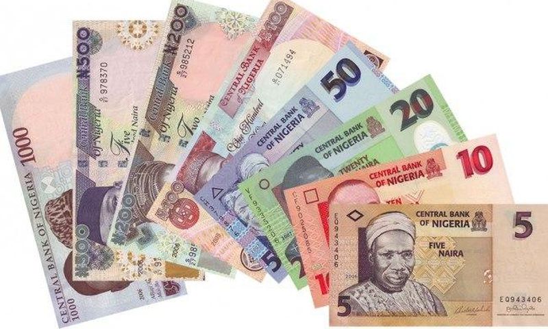 Naira devalues further against dollar at N372 to $1