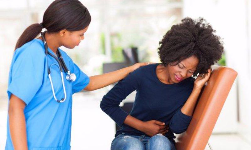African woman having menstrual cramps