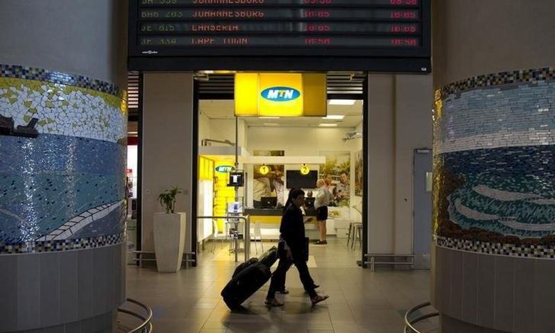Travellers walk past an MTN telecom shop at King Shaka International Airport in Durban, South Africa, November 16, 2015. REUTERS/Rogan Ward