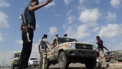 Members of the pro-government Popular Committees militia man a checkpoint at an entrance of Yemen"s southern port city of Aden December 3, 2015.