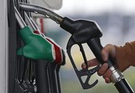 ___4284198___https:______static.pulse.com.gh___webservice___escenic___binary___4284198___2015___10___22___13___455174-a-customer-prepares-to-fill-the-tank-of-her-car-at-a-fuel-station
