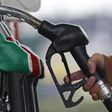 ___4284198___https:______static.pulse.com.gh___webservice___escenic___binary___4284198___2015___10___22___13___455174-a-customer-prepares-to-fill-the-tank-of-her-car-at-a-fuel-station