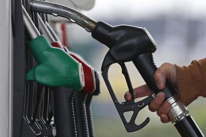 ___4284198___https:______static.pulse.com.gh___webservice___escenic___binary___4284198___2015___10___22___13___455174-a-customer-prepares-to-fill-the-tank-of-her-car-at-a-fuel-station