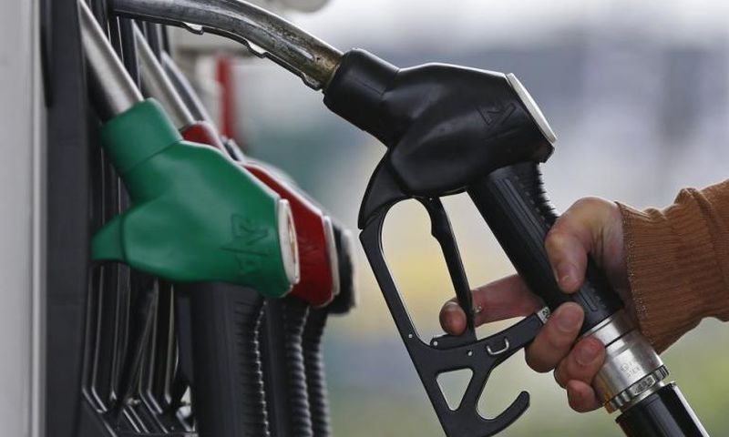 ___4284198___https:______static.pulse.com.gh___webservice___escenic___binary___4284198___2015___10___22___13___455174-a-customer-prepares-to-fill-the-tank-of-her-car-at-a-fuel-station