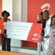 Lucy Quist, Airtel Ghana’s Managing Director (2 from left) making a presentation to Rev. Divine Galley (2 from right). With them are Tina Muparadzi (left), HR Director-Airtel