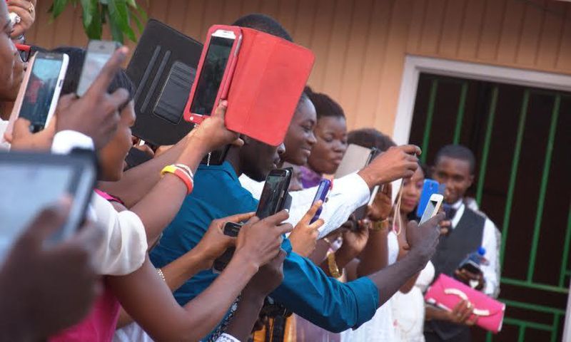 If you are not the official photographer, don't distract others. Don't run around taking pictures of every moment.