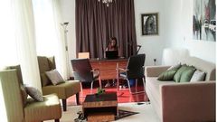 Linda Ikeji working in her office mansion