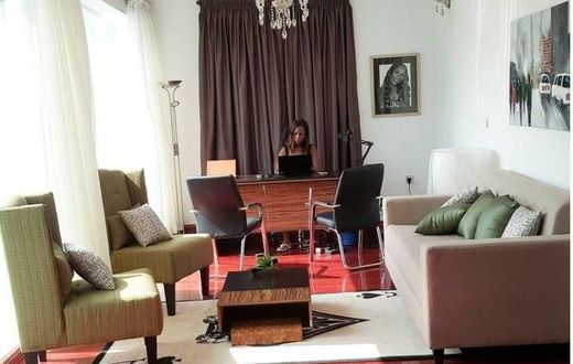 Linda Ikeji working in her office mansion