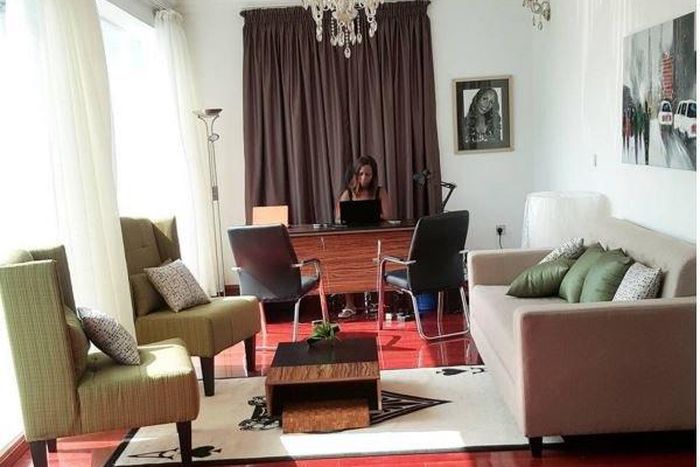 Linda Ikeji working in her office mansion