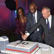Momar Nguer (centre), Total's Africa and Middle East Senior Vice President, former Total Kenya managing director Ms Ada Eze (left) and Total Kenya chairman Jean-Christian Bergeron cut a cake to celebrate the firms 60th anniversary.