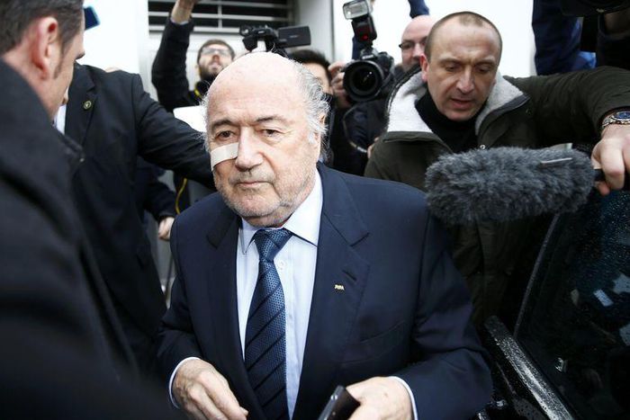 FIFA President Sepp Blatter is surrounded by media as he arrives for a news conference in Zurich, Switzerland, December 21, 2015. REUTERS/Arnd Wiegmann