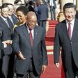 Chinese President Xi Jinping walks with South African President Jacob Zuma upon his arrival at the Union Buildings in Pretoria , December 2, 2015. REUTERS/Sydney Seshibedi