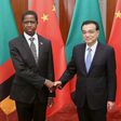 Chinese Premier Li Keqiang (R) shakes hands with Zambia's President Edgar Chagwa Lungu at the Great Hall of the People in Beijing March 30, 2015. REUTERS/Feng Li/Pool