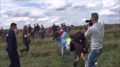 Hungarian TV journalist fired for tripping up fleeing migrants
