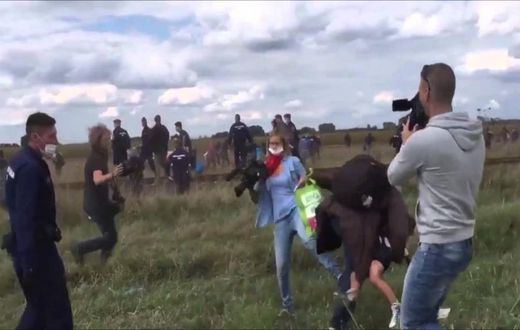 Hungarian TV journalist fired for tripping up fleeing migrants