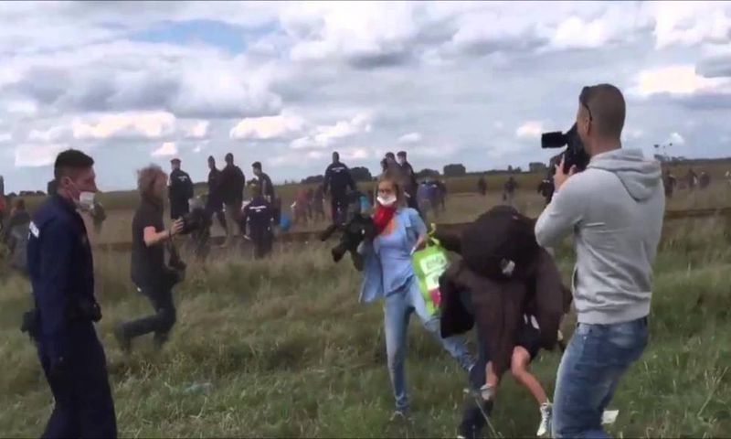 Hungarian TV journalist fired for tripping up fleeing migrants